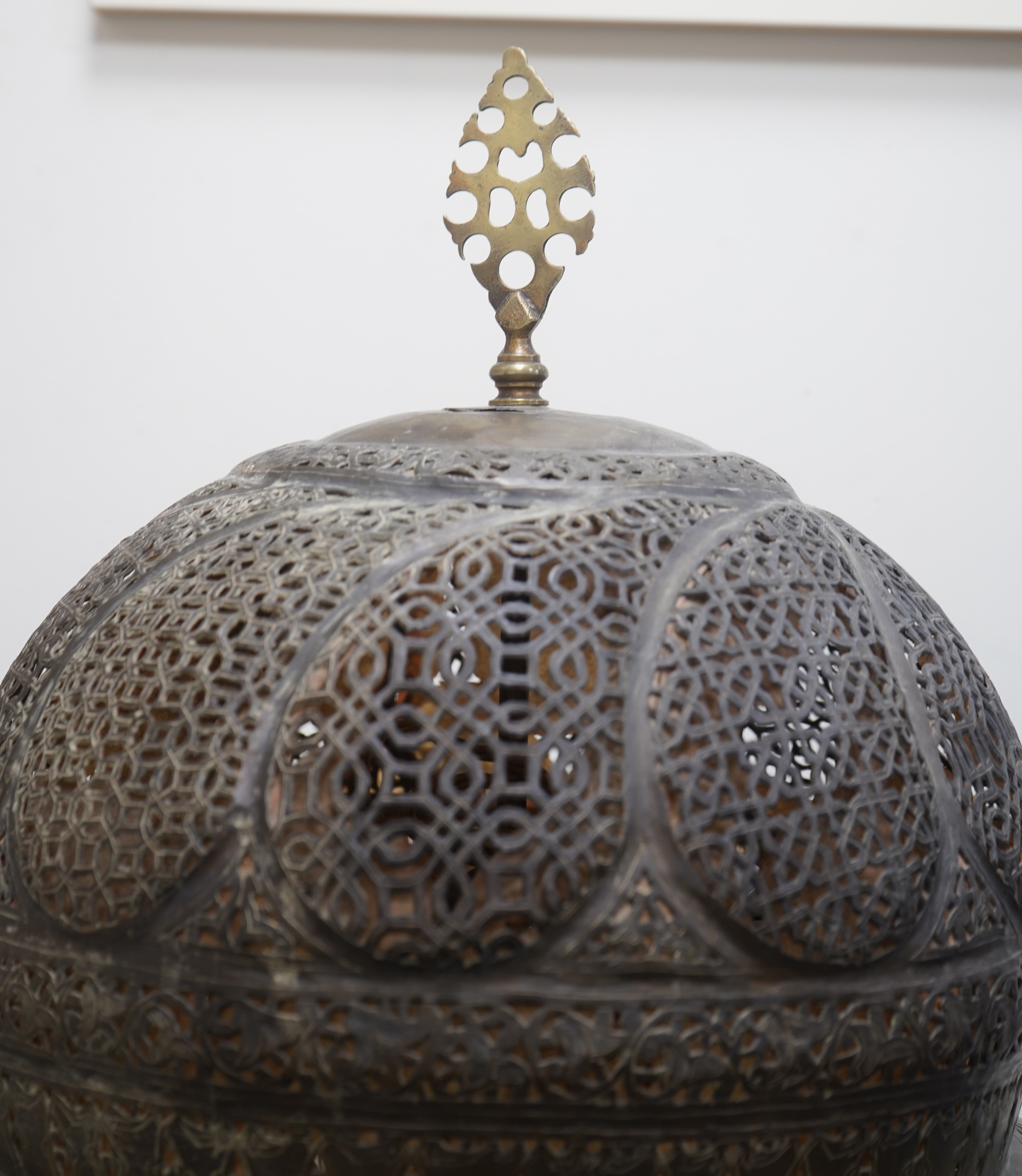 A large Moroccan pierced brass lamp and shade, 20th century